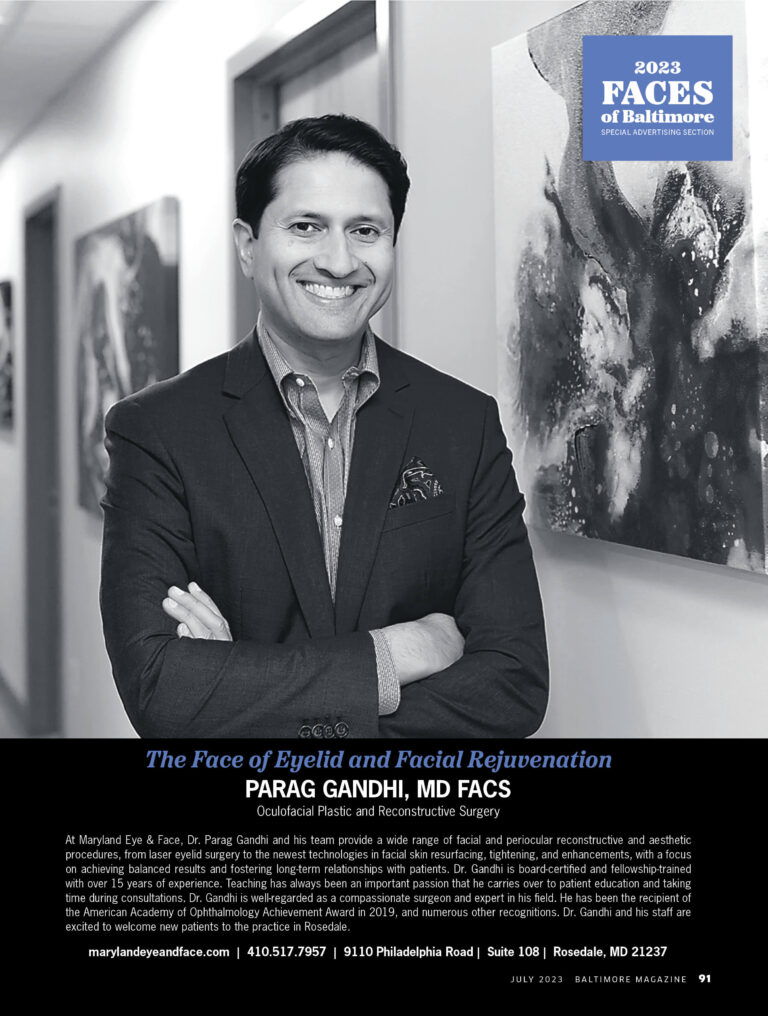 Dr. Parag Gandhi in a suit stands beside abstract artwork in a corridor. Text reads "Faces of Baltimore 2023" and "Parag Gandhi, MD FACS" with contact info below